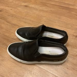 Common projects leather slip on.